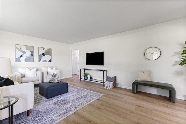 10965 Bunton Rd, Willis, MI 48191 - living area featuring light wood-type flooring and baseboards