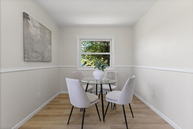 10965 Bunton Rd, Willis, MI 48191 - dining space featuring wood finished floors and wainscoting