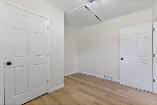 10965 Bunton Rd, Willis, MI 48191 - spare room with attic access and light wood-type flooring