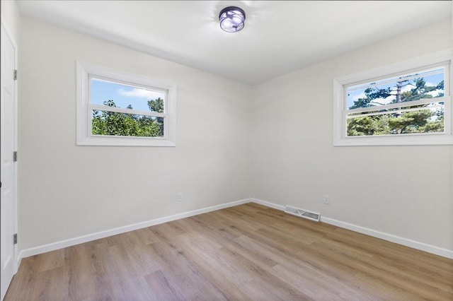 10965 Bunton Rd, Willis, MI 48191 - unfurnished room with plenty of natural light and light wood finished floors