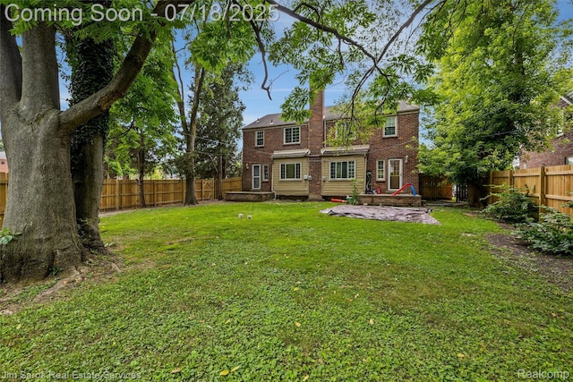 302 Alter Rd, Detroit, MI 48215 - back of house featuring a fenced backyard and brick siding