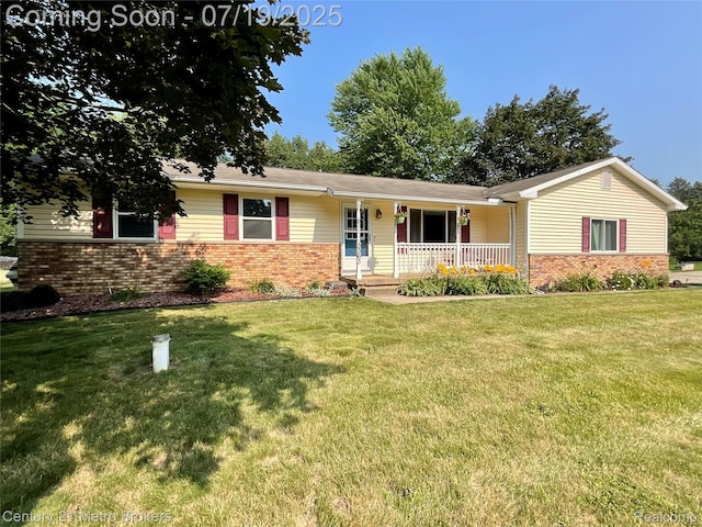 5363 Irish Rd, Grand Blanc, MI 48439 - single story home featuring covered porch, brick siding, and a front lawn