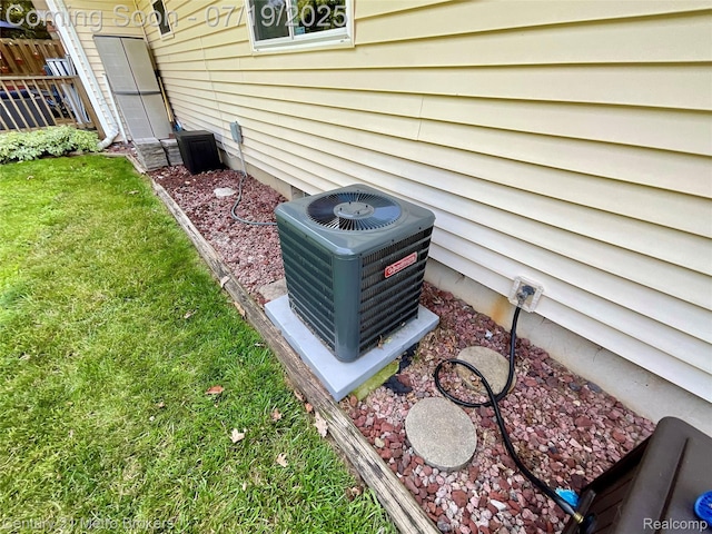 5363 Irish Rd, Grand Blanc, MI 48439 - exterior view of a wood stove and a central air condition unit