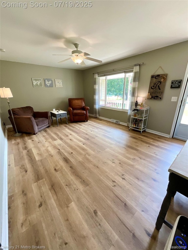5363 Irish Rd, Grand Blanc, MI 48439 - living area featuring wood finished floors and ceiling fan
