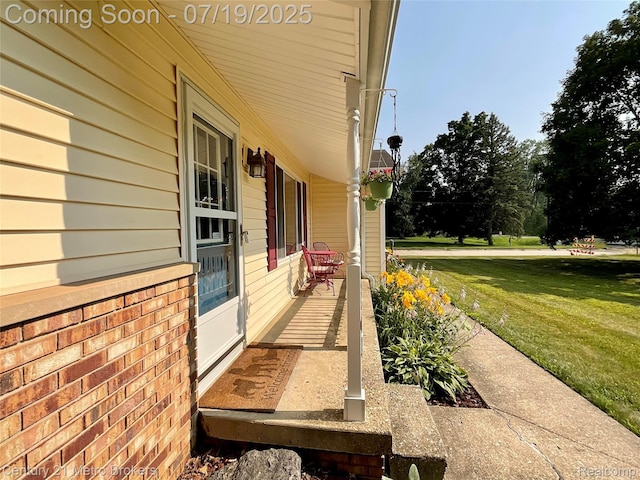 5363 Irish Rd, Grand Blanc, MI 48439 - covered porch featuring a lawn
