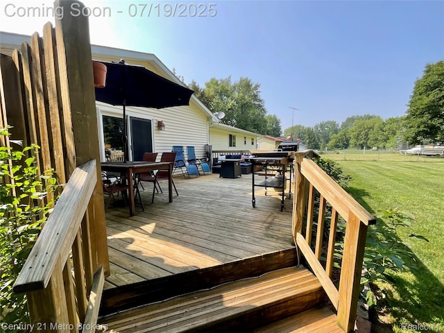 5363 Irish Rd, Grand Blanc, MI 48439 - deck featuring outdoor dining area, a lawn, and a grill