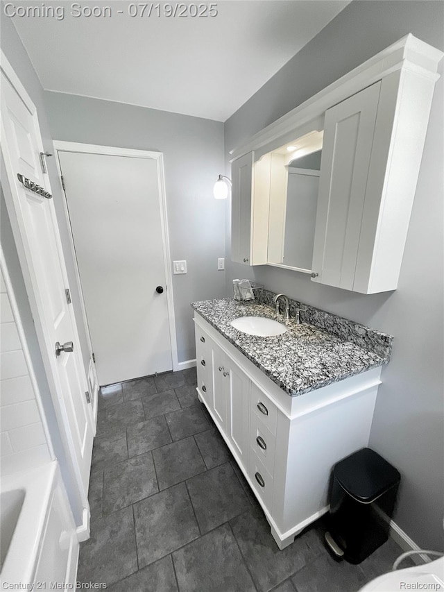 5363 Irish Rd, Grand Blanc, MI 48439 - bathroom featuring vanity and a tub to relax in