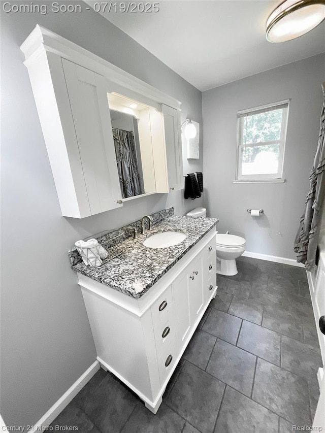 5363 Irish Rd, Grand Blanc, MI 48439 - bathroom with vanity and baseboards