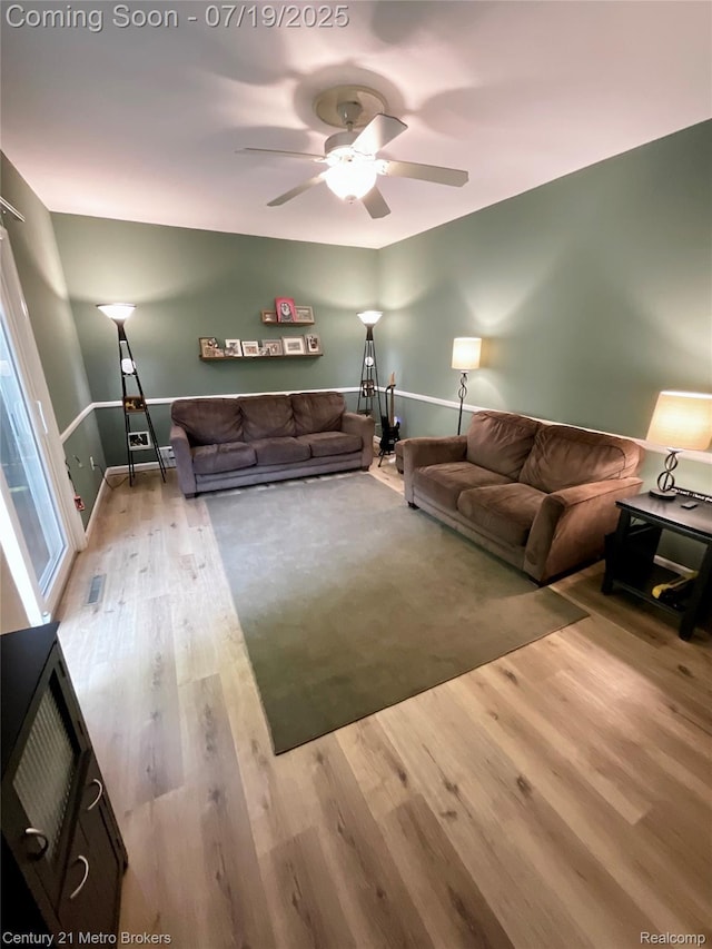 5363 Irish Rd, Grand Blanc, MI 48439 - living area featuring wood finished floors and ceiling fan