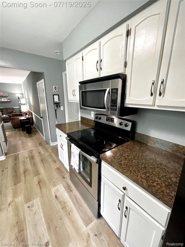 5363 Irish Rd, Grand Blanc, MI 48439 - kitchen with stainless steel appliances, white cabinets, light wood-type flooring, and open floor plan