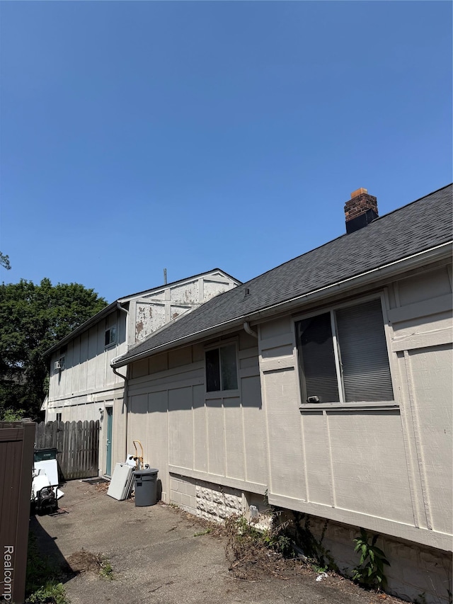 730 Wallace St, Birmingham, MI 48009 - view of property exterior featuring a chimney and a shingled roof