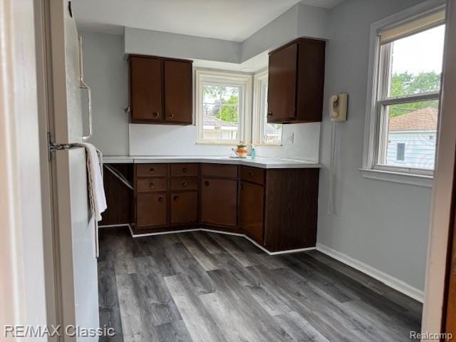 242 E Parker Ave, Madison Heights, MI 48071 - kitchen with light countertops, dark wood finished floors, and freestanding refrigerator