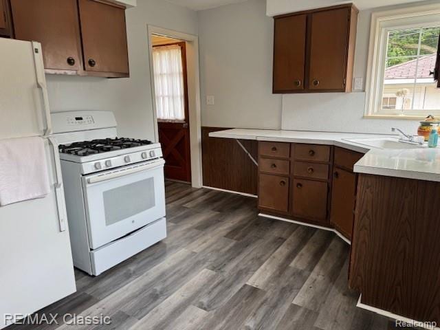 242 E Parker Ave, Madison Heights, MI 48071 - kitchen with white appliances, dark wood-type flooring, and light countertops