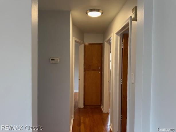 242 E Parker Ave, Madison Heights, MI 48071 - hallway with dark wood-type flooring and baseboards