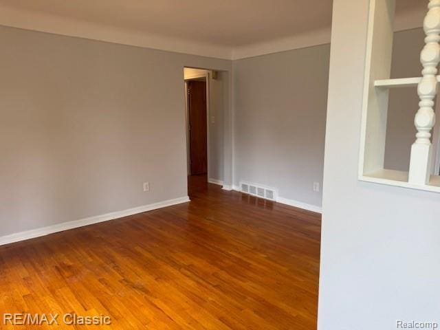 242 E Parker Ave, Madison Heights, MI 48071 - spare room featuring wood finished floors and baseboards