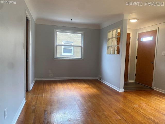 242 E Parker Ave, Madison Heights, MI 48071 - unfurnished room featuring wood finished floors and baseboards