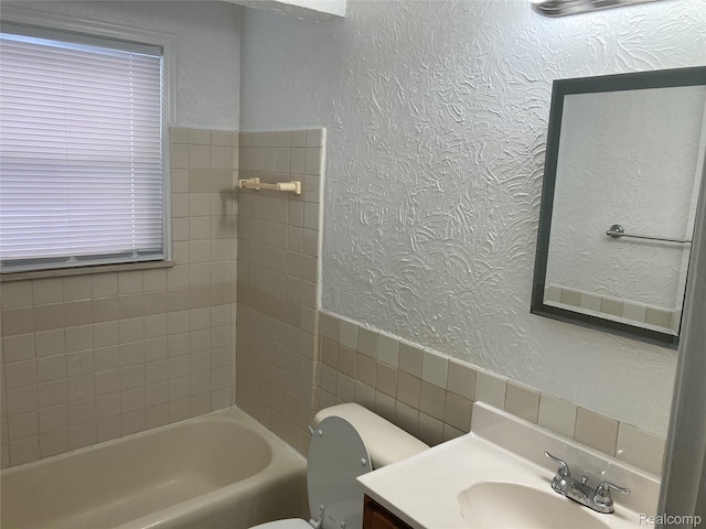 24924 Wilmot Ave, Eastpointe, MI 48021 - full bath with vanity, a textured wall, and tile walls