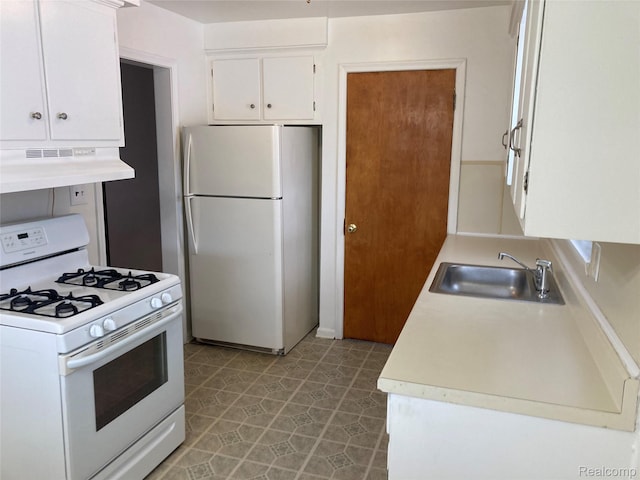 24924 Wilmot Ave, Eastpointe, MI 48021 - kitchen featuring white appliances, under cabinet range hood, white cabinetry, light countertops, and light floors