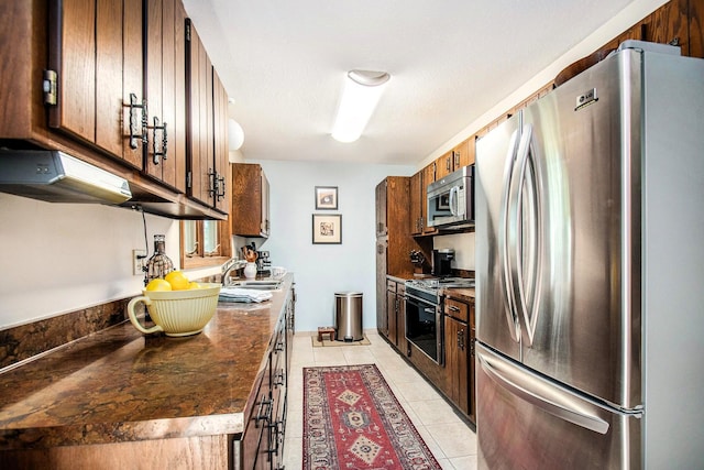 18354 Mount Zion Rd, Galien, MI 49113 - kitchen with appliances with stainless steel finishes, light tile patterned flooring, and dark countertops