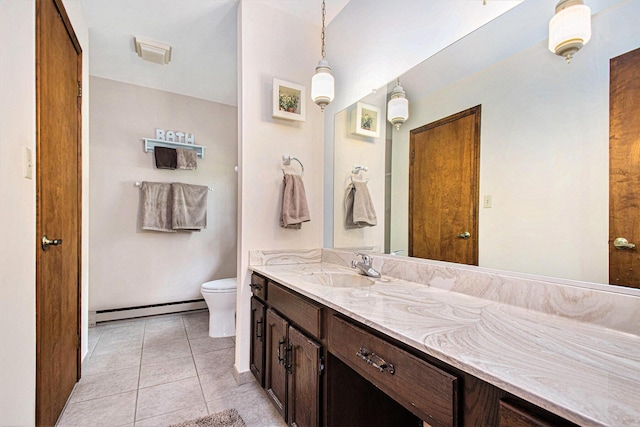 18354 Mount Zion Rd, Galien, MI 49113 - bathroom featuring baseboard heating, double vanity, and tile patterned floors
