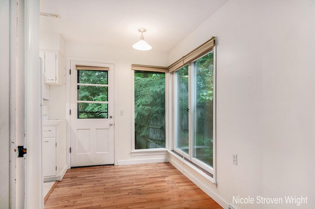 2146 Lansing St SE, Grand Rapids, MI 49506 - doorway to outside with healthy amount of natural light and light wood-style floors