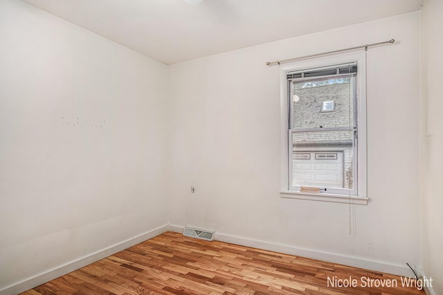 2146 Lansing St SE, Grand Rapids, MI 49506 - empty room featuring baseboards and wood finished floors