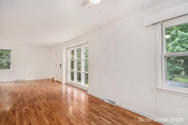 2146 Lansing St SE, Grand Rapids, MI 49506 - spare room with plenty of natural light, light wood finished floors, and ceiling fan