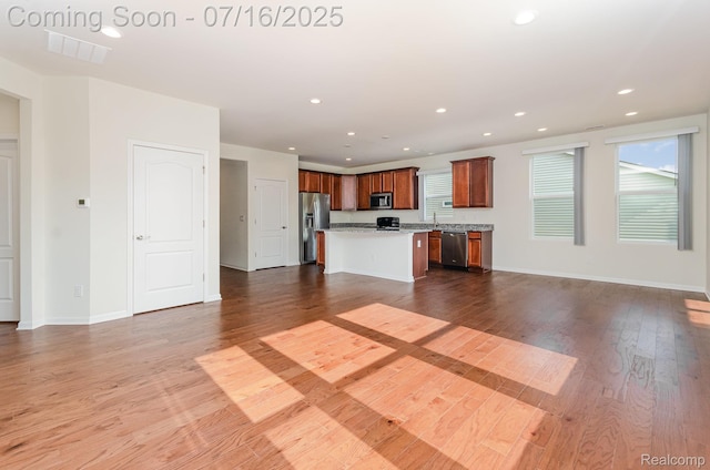 4000 Ashdale Way, Clarkston, MI 48348 - unfurnished living room with wood finished floors and recessed lighting