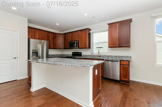 4000 Ashdale Way, Clarkston, MI 48348 - kitchen featuring appliances with stainless steel finishes, dark wood-type flooring, a center island, healthy amount of natural light, and recessed lighting