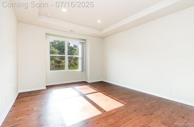 4000 Ashdale Way, Clarkston, MI 48348 - empty room with wood finished floors, a raised ceiling, and recessed lighting