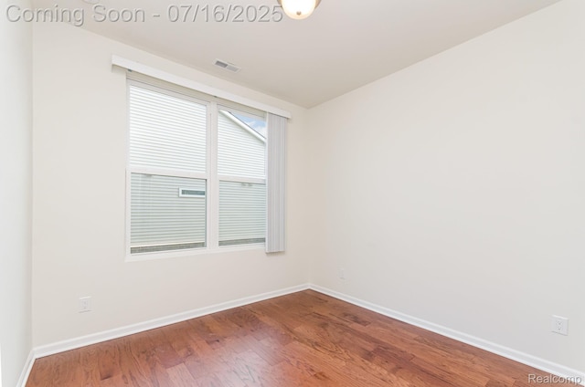 4000 Ashdale Way, Clarkston, MI 48348 - spare room featuring baseboards and wood finished floors