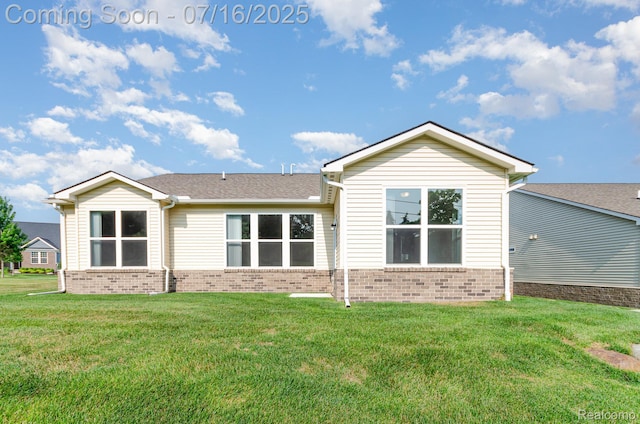 4000 Ashdale Way, Clarkston, MI 48348 - back of house with a yard, brick siding, and roof with shingles