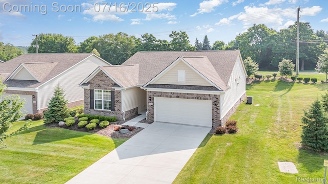4000 Ashdale Way, Clarkston, MI 48348 - view of front of home with an attached garage, concrete driveway, roof with shingles, a front yard, and brick siding