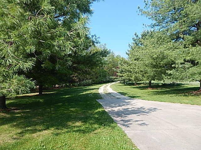 8475 Gurd Rd, Dowling, MI 49050 - surrounding community with a lawn