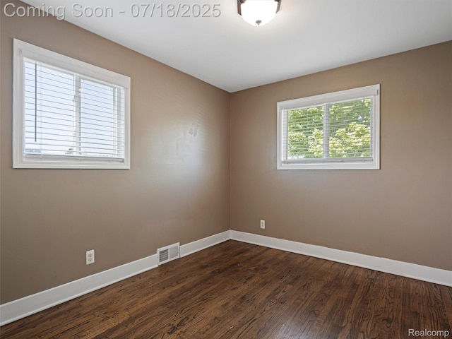 27034 Baldwin Ave, Warren, MI 48092 - empty room featuring baseboards and dark wood-type flooring