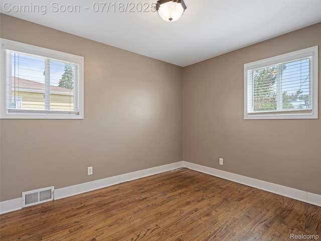 27034 Baldwin Ave, Warren, MI 48092 - empty room with plenty of natural light and dark wood-style flooring