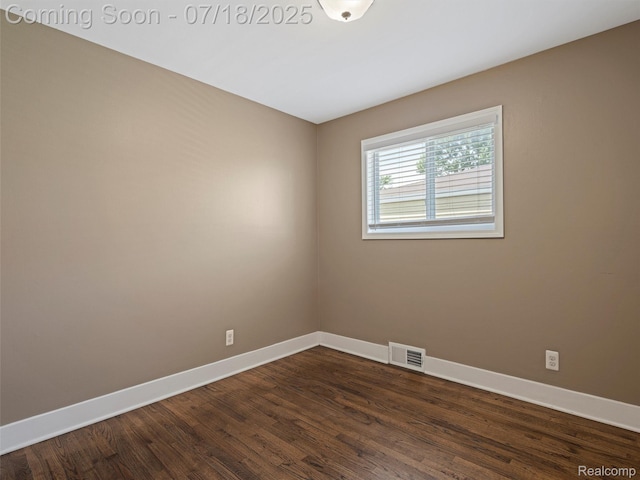27034 Baldwin Ave, Warren, MI 48092 - empty room featuring baseboards and dark wood-style flooring