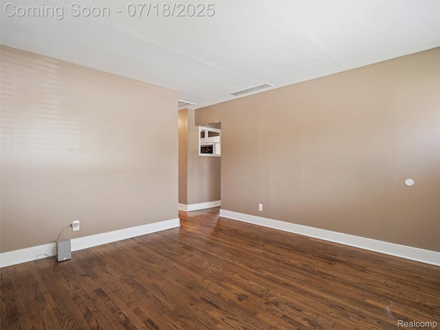 27034 Baldwin Ave, Warren, MI 48092 - empty room with baseboards and dark wood-style flooring