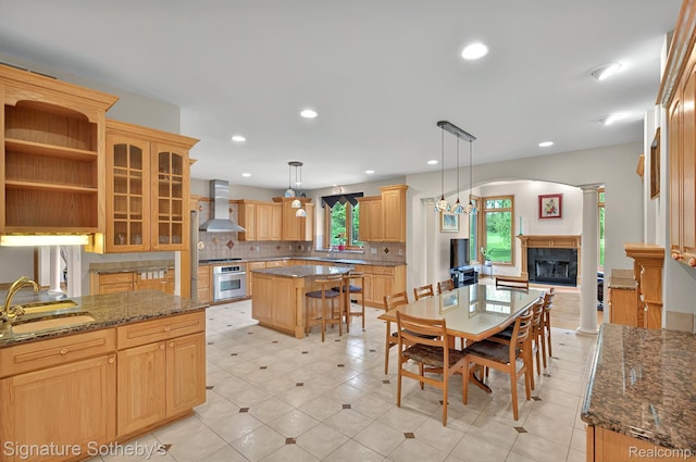 40600 8 Mile Rd, Northville, MI 48167 - dining area with a fireplace with raised hearth, light tile patterned floors, and recessed lighting