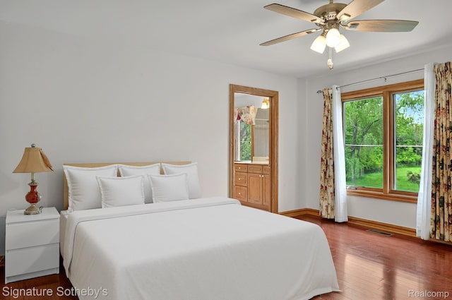 40600 8 Mile Rd, Northville, MI 48167 - bedroom with wood finished floors, ensuite bath, and ceiling fan
