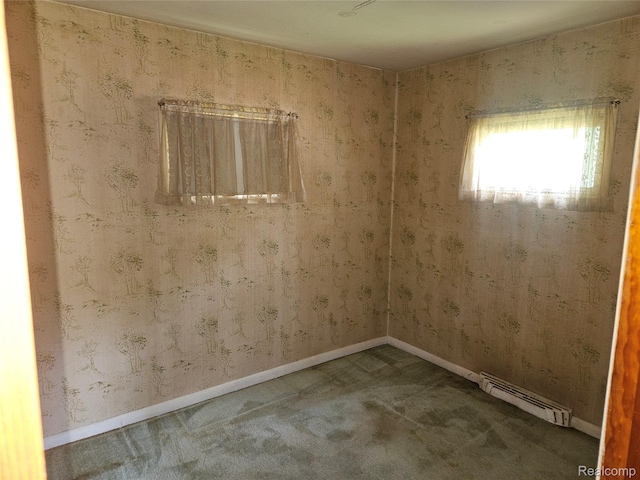 1081 W Parkwood Ave, Flint, MI 48507 - carpeted spare room featuring baseboard heating and baseboards