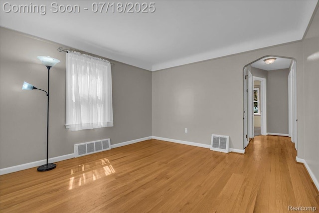 24429 Notre Dame St, Dearborn, MI 48124 - spare room with arched walkways and wood finished floors