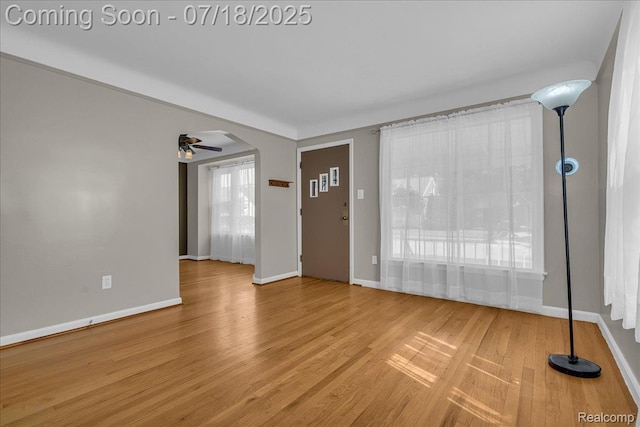 24429 Notre Dame St, Dearborn, MI 48124 - entrance foyer with wood finished floors, arched walkways, and ceiling fan