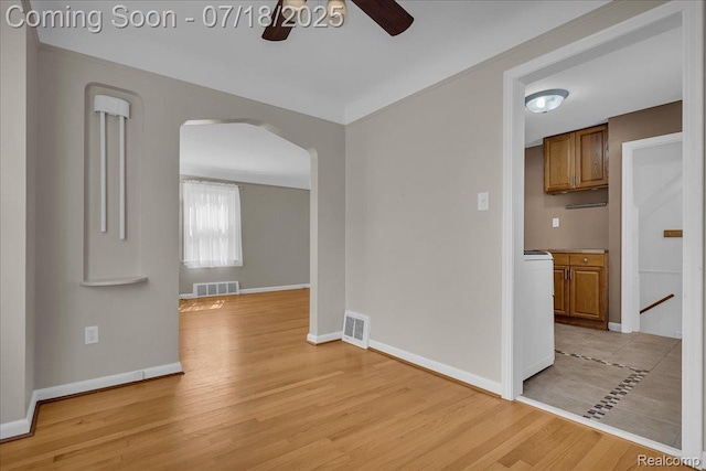 24429 Notre Dame St, Dearborn, MI 48124 - empty room featuring ceiling fan, arched walkways, and light wood-style flooring