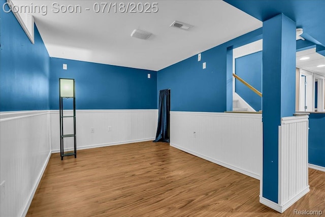 24429 Notre Dame St, Dearborn, MI 48124 - empty room with wood finished floors and a wainscoted wall