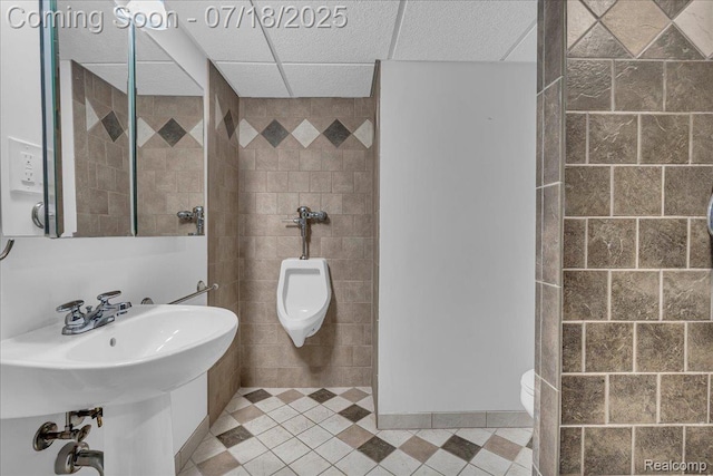 24429 Notre Dame St, Dearborn, MI 48124 - bathroom featuring a drop ceiling, tile patterned floors, and tile walls