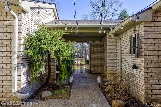 1470 Timberview Trl, Bloomfield Hills, MI 48304 - doorway to property with brick siding, a gate, and a shingled roof
