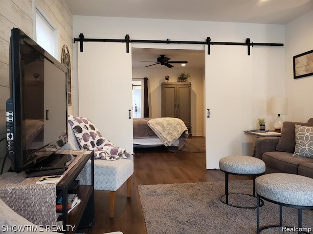425 Broadway St, Marine City, MI 48039 - bedroom featuring a barn door and dark wood-type flooring