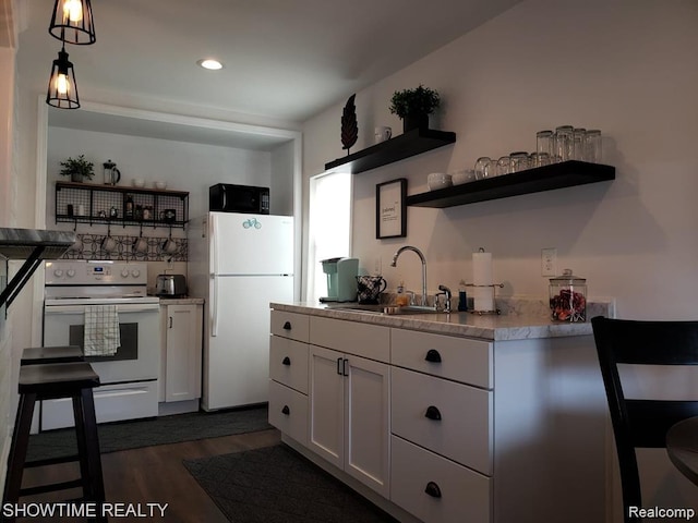 425 Broadway St, Marine City, MI 48039 - kitchen featuring white appliances, open shelves, dark wood finished floors, white cabinets, and recessed lighting