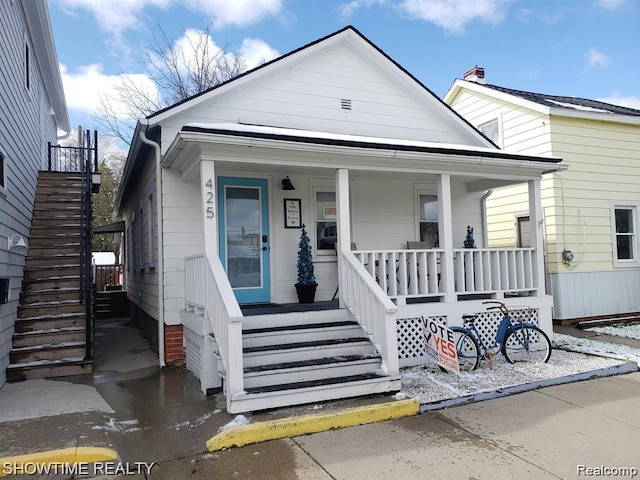 425 Broadway St, Marine City, MI 48039 - view of front of property featuring stairway and covered porch